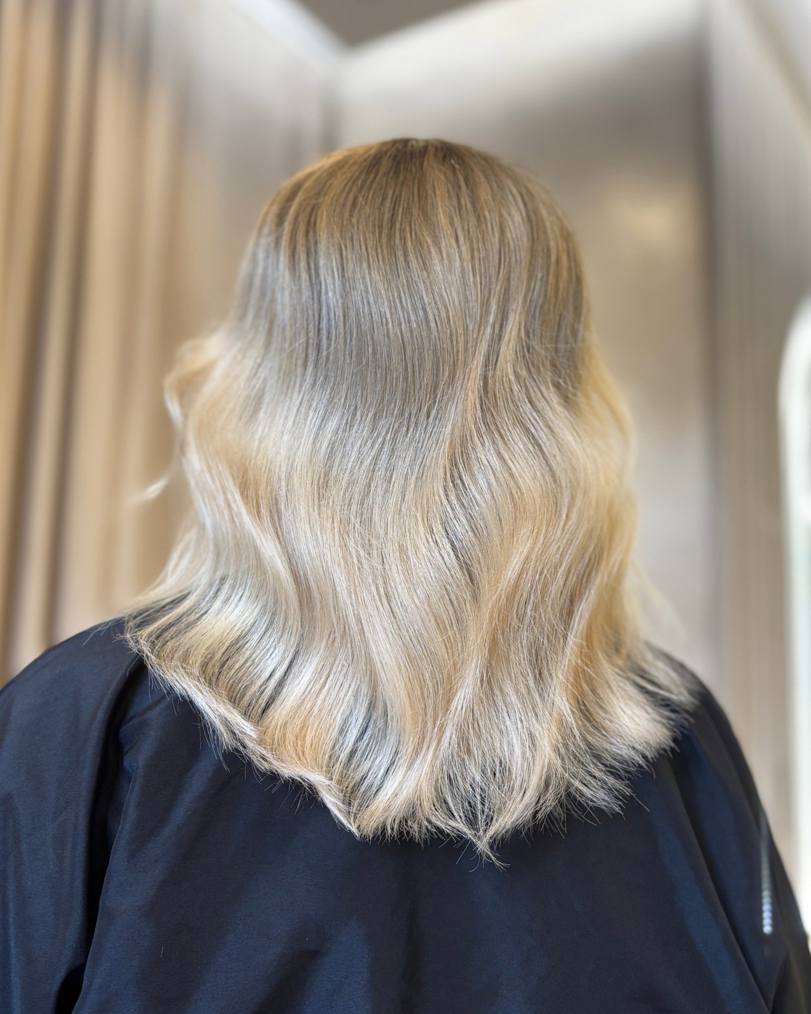 Wide shot of TAN CENTRAL salon atmosphere